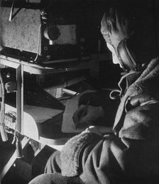 RAF Coastal Command radio operator on board his aircraft, c1940 (1943)
