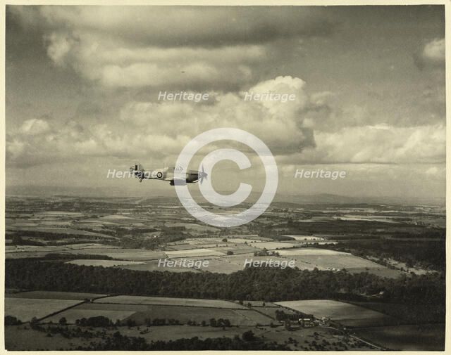RAF Film Production Unit film still showing a 'hurribomber' in flight, 1942. Creator: Royal Air Force Fim Production Unit.