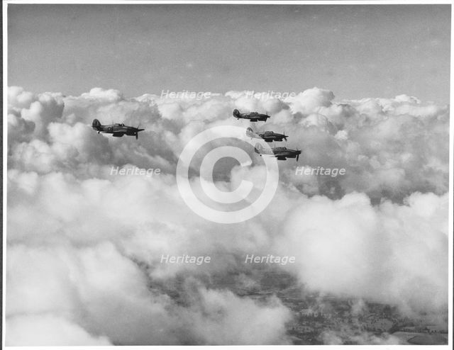 RAF Film Production Unit film still showing a 'hurribomber' in flight, 1942. Creator: Royal Air Force Fim Production Unit.