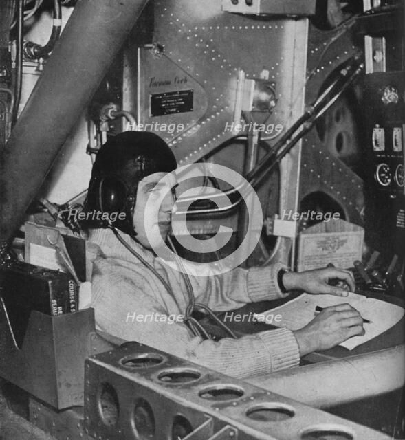 RAF flight engineer on board an aircraft, c1940 (1943). Artist: Unknown.