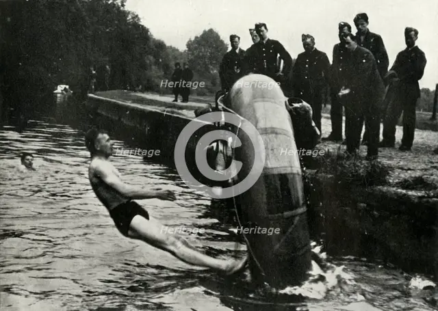 RAF personnel learning to use a dinghy, 1941.  Creator: Charles Brown.