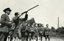 RAF personnel learning to fire guns during the Second World War, 1941. Creator: Charles Brown