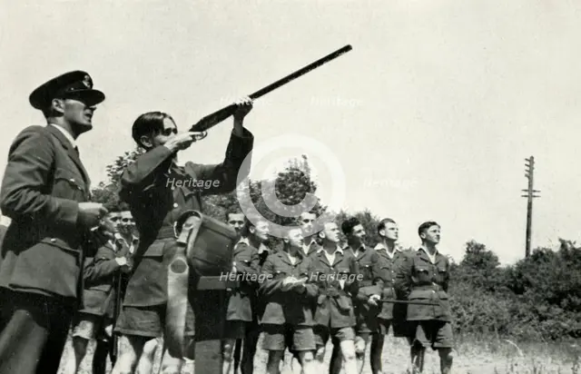 RAF personnel learning to fire guns during the Second World War, 1941. Creator: Charles Brown.