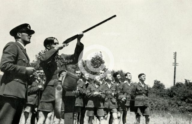 RAF personnel learning to fire guns during the Second World War, 1941. Creator: Charles Brown.