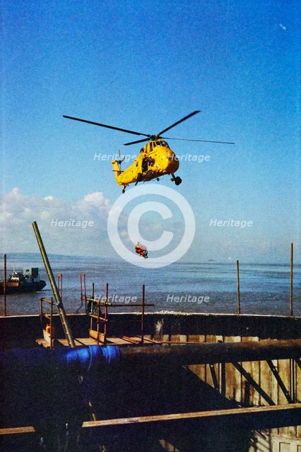 RAF Rescue helicopter hovering over the Second Severn Construction site..., Apr 1992 - 1995. Creator: John Laing plc.