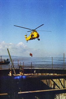 RAF Rescue helicopter hovering over the Second Severn Construction site..., Apr 1992 - 1995. Creator: John Laing plc