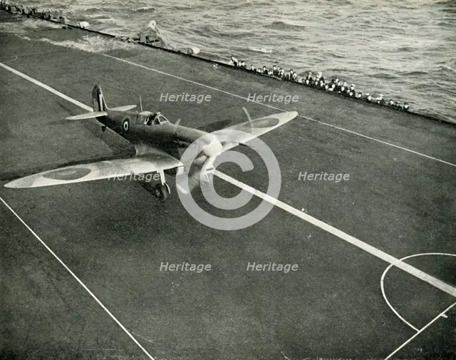 RAF Spitfire on the deck of an aircraft carrier on its way to Malta, World War II, 1942 (1944). Creator: Unknown.