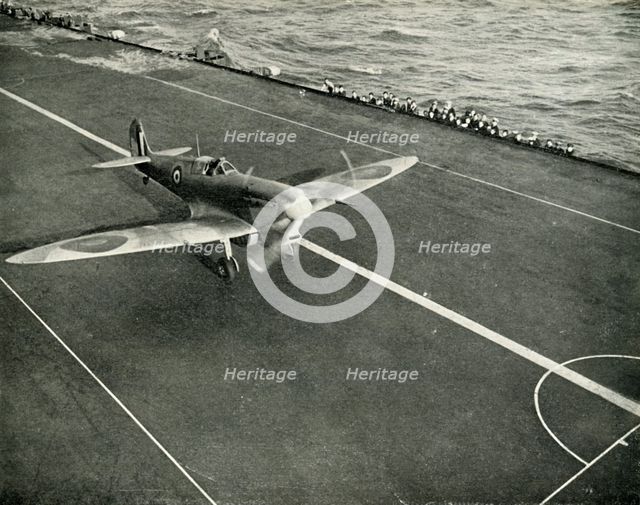 RAF Spitfire on the deck of an aircraft carrier on its way to Malta, World War II, 1942 (1944). Creator: Unknown.