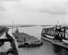 Raft passing drawbridge, Winona, Minn., between 1880 and 1899. Creator: Unknown