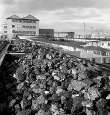 Rail trucks loaded with coal leaving Lynemouth Colliery, Northumberland, 1963. Creator: Michael Walters