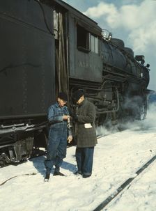 Railroad conductor George E. Burton and engineer J.W. Edwards...Chicago, Ill., 1943. Creator: Jack Delano