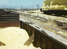 Railroad cars loaded with sulphur, Freeport Sulphur Co., Hoskins Mound, Texas, 1943. Creator: John Vachon