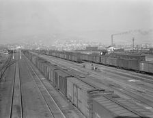 Railroad yard, outskirts of fast-growing town, Klamath Falls, Oregon, 1939. Creator: Dorothea Lange