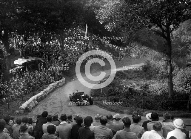 Railton light sports tourer competing in the Shelsley Walsh Hillclimb, Worcestershire, 1935. Artist: Bill Brunell.