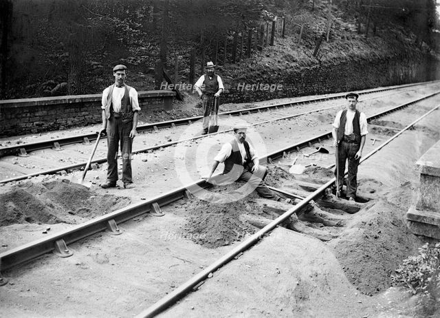 Railway tracklayers at work, Bodmin Road Station, Cornwall, 1901. Artist: Alfred Newton & Sons.