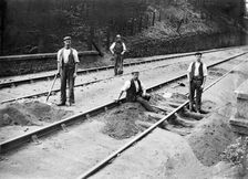 Railway tracklayers at work, Bodmin Road Station, Cornwall, 1901. Artist: Alfred Newton & Sons