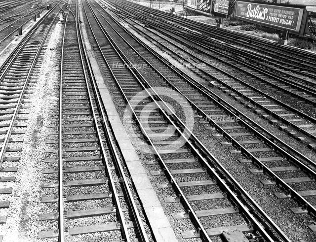 Railway tracks and Butlin's advertisement, c1955. Creator: Arthur Charles Kirby Ware.