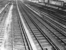 Railway tracks and Butlin's advertisement, c1955. Creator: Arthur Charles Kirby Ware