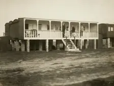 Railway carriage converted into a holiday home, possibly at Shoreham-by-Sea, West Sussex, 1920s