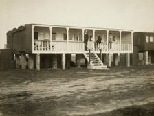 Railway carriage converted into a holiday home, possibly at Shoreham-by-Sea, West Sussex, 1920s