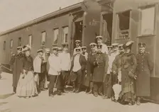 Railway employees against the background of train cars, 1910-1919. Creator: Unknown