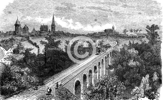 Railway line from Vitré to Fougères. Pass of a steam train by the viaduct on the Vilaine near Vit…