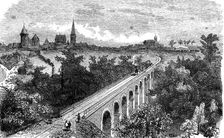 Railway line from Vitré to Fougères. Pass of a steam train by the viaduct on the Vilaine near Vit…