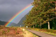 Rainbow over the road from Ullapool to Torridon, Highland, Scotland. Creator: Peter Thompson