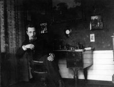 Rainer Maria Rilke in his study, c. 1905. Creator: Anonymous