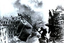 Raising a flag over the Reichstag, 2 May 1945. Creator: Yevgeny Khaldei