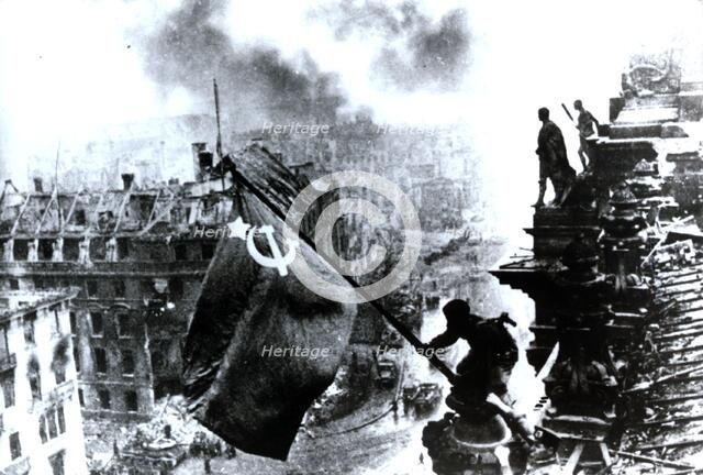 Raising a flag over the Reichstag, 2 May 1945. Artist: Yevgeny Khaldei