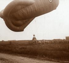 Raising of barrage balloon with basket for observation, c1914-c1918