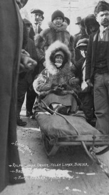 Ralph and Helen Lomen on dog sled, ready for race, 1915. Creator: Lomen Brothers