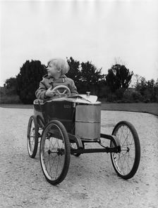 Ralph (Lord) Montagu as a child in Vauxhall pedal car 1966. Creator: Unknown