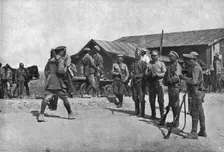 Ramenés au Devoir; Deserteurs repentis barrant une route pour arreter a leur tour de..., 1917. Creator: Unknown
