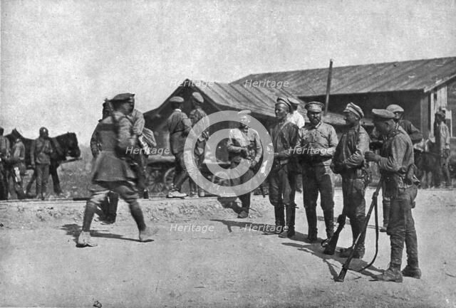 'Ramenés au Devoir; Deserteurs repentis barrant une route pour arreter a leur tour de..., 1917. Creator: Unknown.