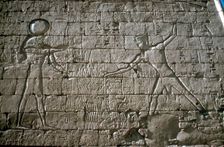 Rameses III smiting his enemies before Amun-Ra, Mortuary Temple, Medinat Habu, Egypt, c12th cen BC
