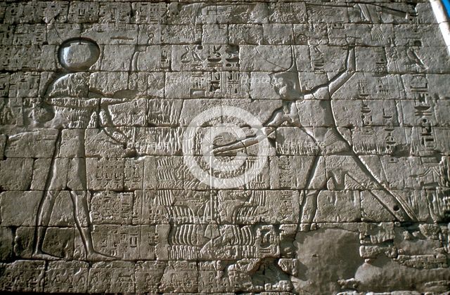 Rameses III smiting his enemies before Amun-Ra, Mortuary Temple, Medinat Habu, Egypt, c12th cen BC. Artist: Unknown
