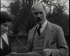 Ramsay MacDonald and His Daughter Ishbel Allan MacDonald Standing Beside a Sundial in a Garden,1920s Creator: British Pathe Ltd