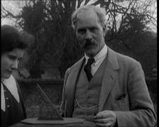 Ramsay MacDonald and His Daughter Ishbel Allan MacDonald Standing Beside a Sundial in a Garden,1920s Creator: British Pathe Ltd