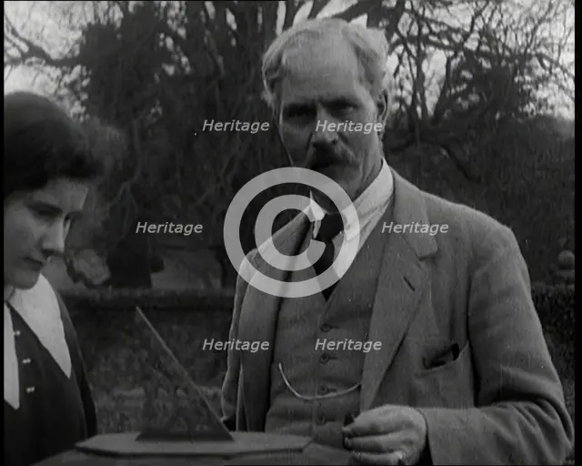 Ramsay MacDonald and His Daughter Ishbel Allan MacDonald Standing Beside a Sundial in a Garden,1920s Creator: British Pathe Ltd.