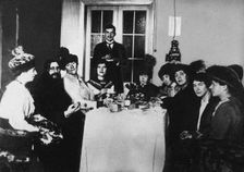 Rasputin (second from left) at the meal among His Admirers, c. 1910