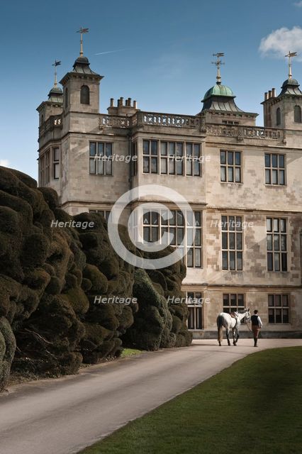 Re-enactor leading a horse towards Audley End House, Saffron Walden, Essex, 2010. Artist: Andrew Shaylor.