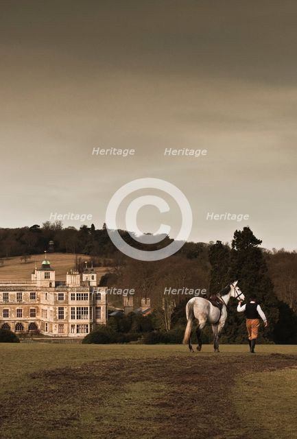 Re-enactor leading a horse towards Audley End House, Saffron Walden, Essex, 2010. Artist: Andrew Shaylor.