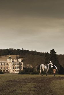 Re-enactor leading a horse towards Audley End House, Saffron Walden, Essex, 2010. Artist: Andrew Shaylor