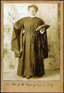 Rev. Mrs. J. H. Vigal of Buffalo, N.Y., arm raised, holding Bible, c1880-c1889. Creator: Unknown