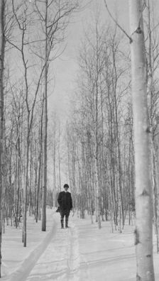 Rev. Burgess on snow covered road, between c1900 and 1927. Creator: Unknown