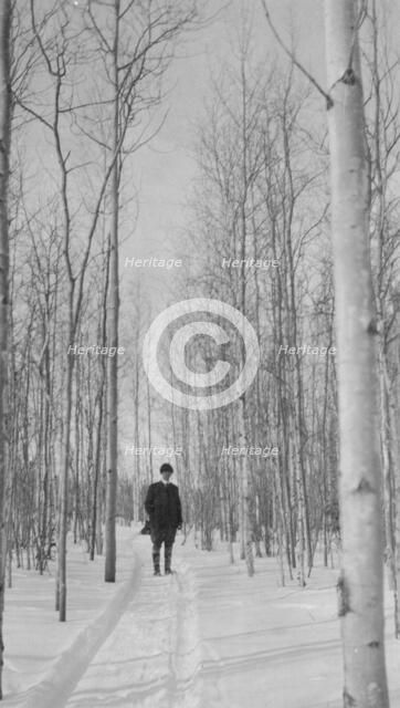 Rev. Burgess on snow covered road, between c1900 and 1927. Creator: Unknown.