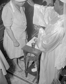 Reverend Clara Smith anointing a member of the St. Martin's Spiritual... Washington, D.C., 1942. Creator: Gordon Parks