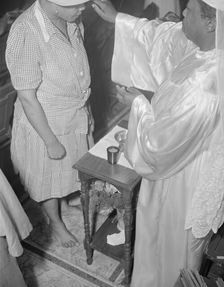Reverend Clara Smith anointing a member of the St. Martin's Spiritual... Washington, D.C., 1942. Creator: Gordon Parks